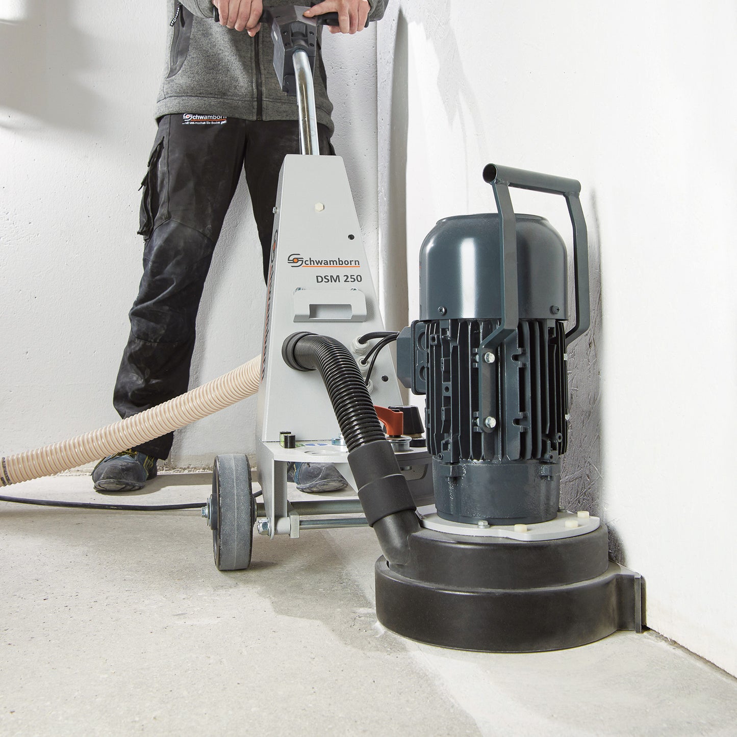 DSM250 Schwamborn Edger Concrete Floor Grinder.
230V, 50Hz, 2.2kW, complete with superior shroud for dust and vibration-free grinding up to the edge, swivel grinding head, height adjustment handle, Knock-On Shoe holder and safety red-locking ring.